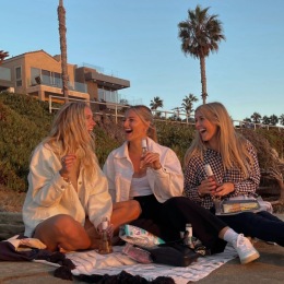 friends laughing together on a beach