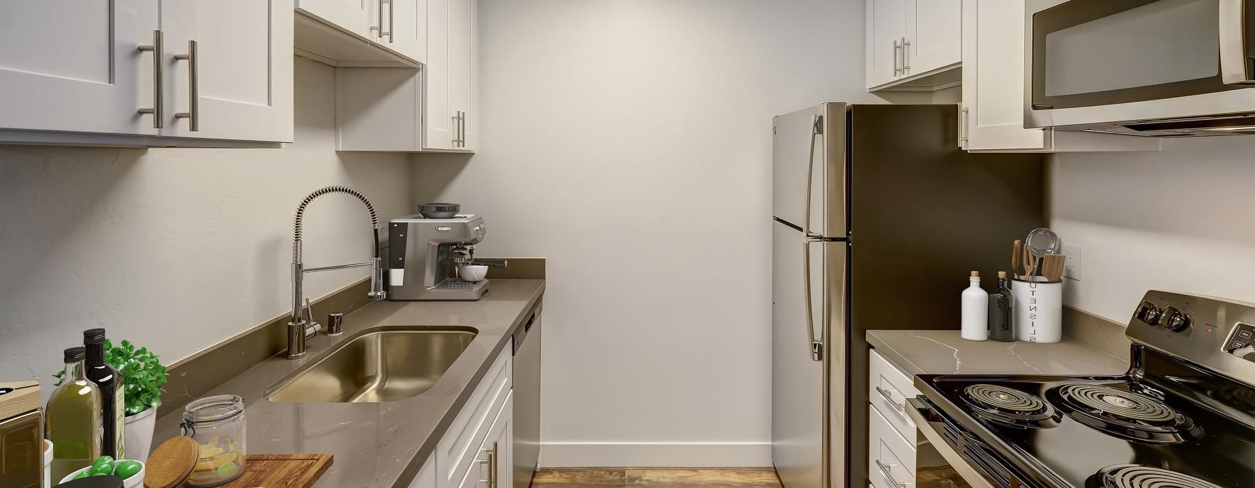 a kitchen with white cabinets