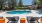 a swimming pool with chairs around it