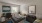 a bedroom with beds and a desk